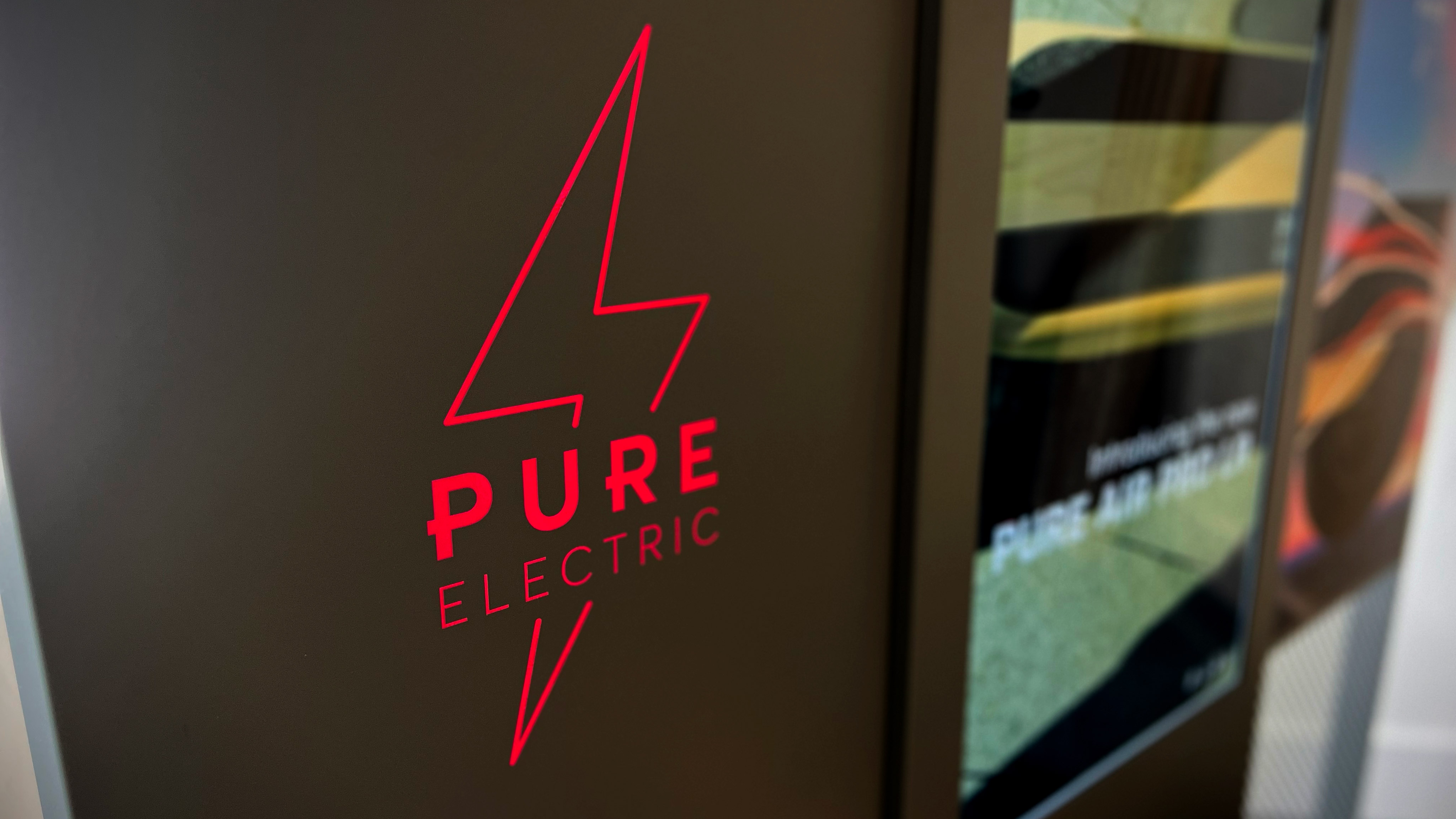 PURE-ELECTRIC illuminated graphic installation display interior retail design and installation - Attero Retail Design Agency