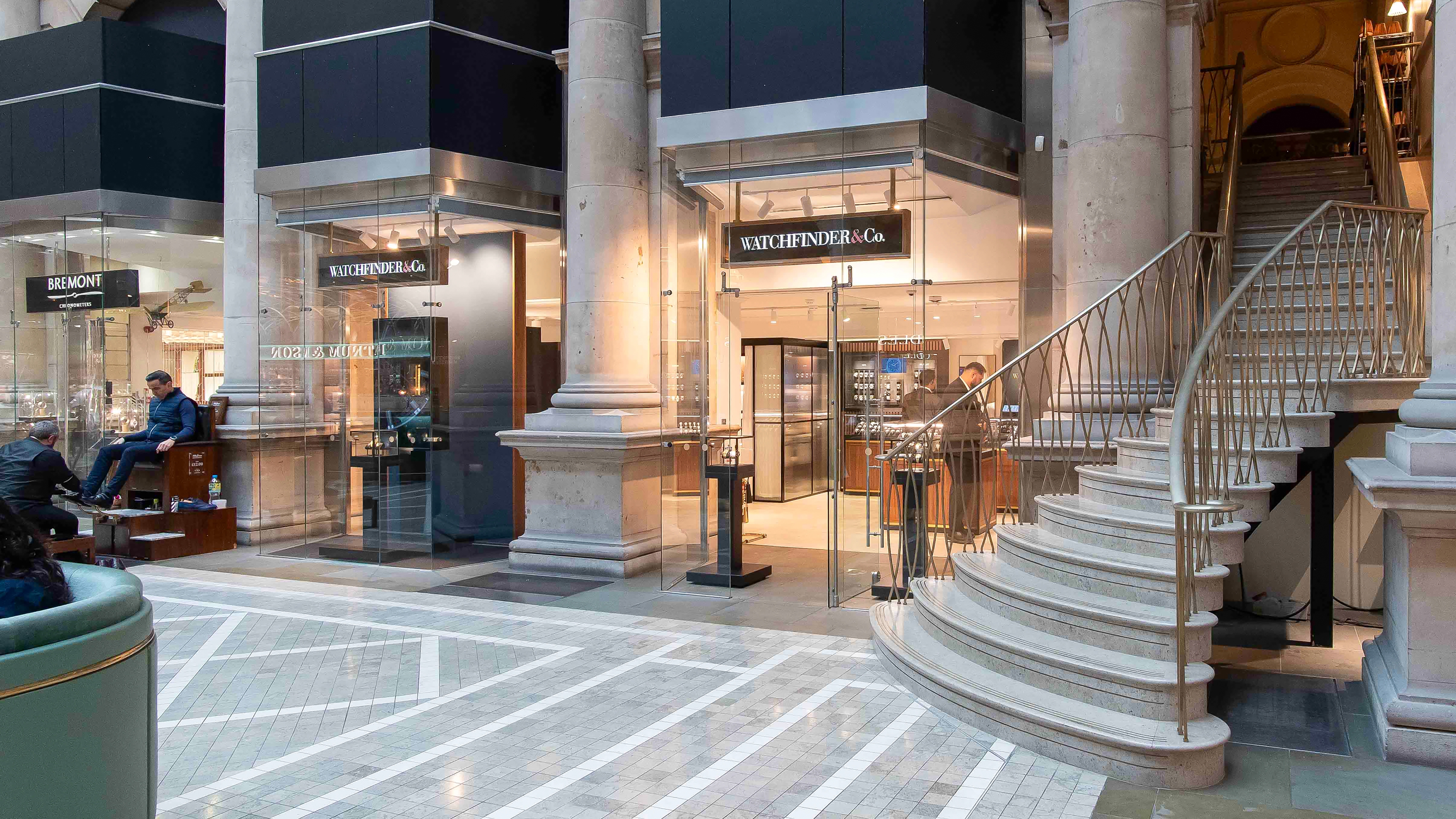 Exterior façade view of the Watchfinder & Co. store at London’s Royal Exchange, designed and delivered by Attero Design. Featuring refined retail architecture, bespoke materials, and luxury brand detailing that reflect high-end store design and craftsmanship.